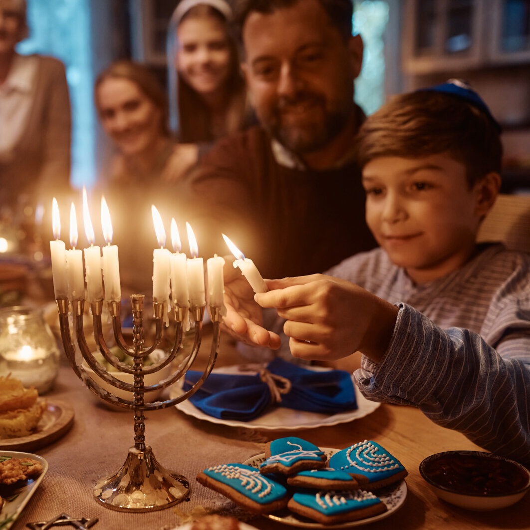 AdobeStock_539551882 Celebration with family, and lighting of Jewish candles,